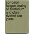 Corrosion fatigue testing of aluminium and glare riveted cap joints