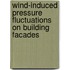 Wind-induced pressure fluctuations on building facades