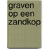 Graven op een zandkop