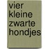 Vier kleine zwarte hondjes