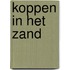 Koppen in het zand