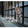 Curious Cats door Mitsuaki Iwago