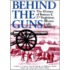 Behind The Guns