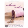 A Thread So Thin door Marie Bostwick