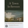 A Town In-Between by Judith Ridner