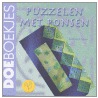 Puzzelen met ponsen