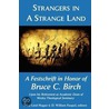 Strangers In A Strange Land door Lucy Lind Hogan
