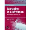 A Practical Guide To Managing In A Downturn door Kate Sayer