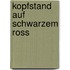 Kopfstand auf schwarzem Ross
