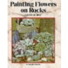 Painting Flowers On Rocks door Lin Wellford