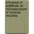 Influence of additives on microstructure of reverse micelles