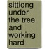Sittiong under the tree and working hard
