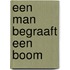 Een man begraaft een boom