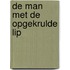 De man met de opgekrulde lip